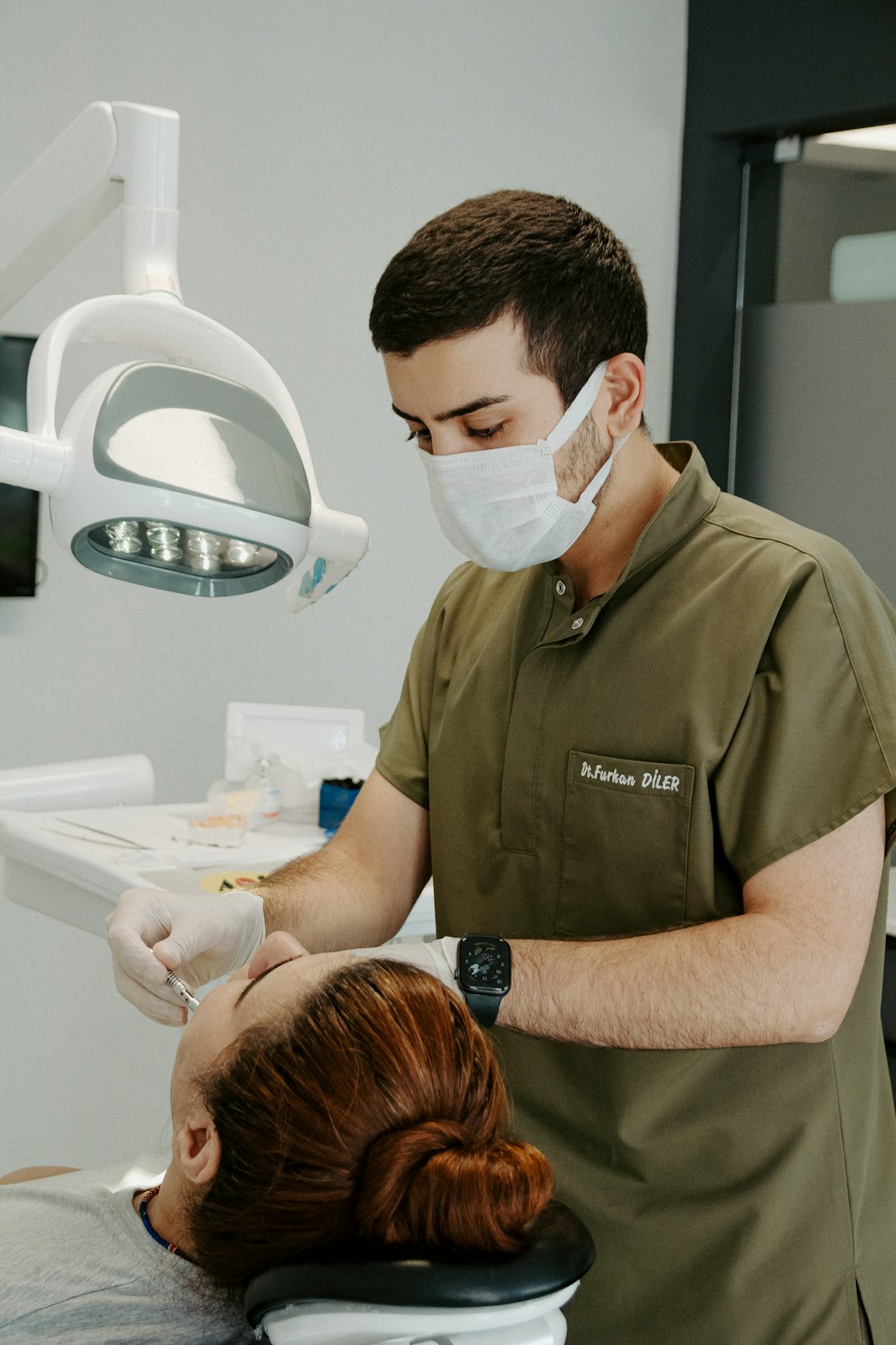 Photo by Ozkan Guner a dentist examining a patient